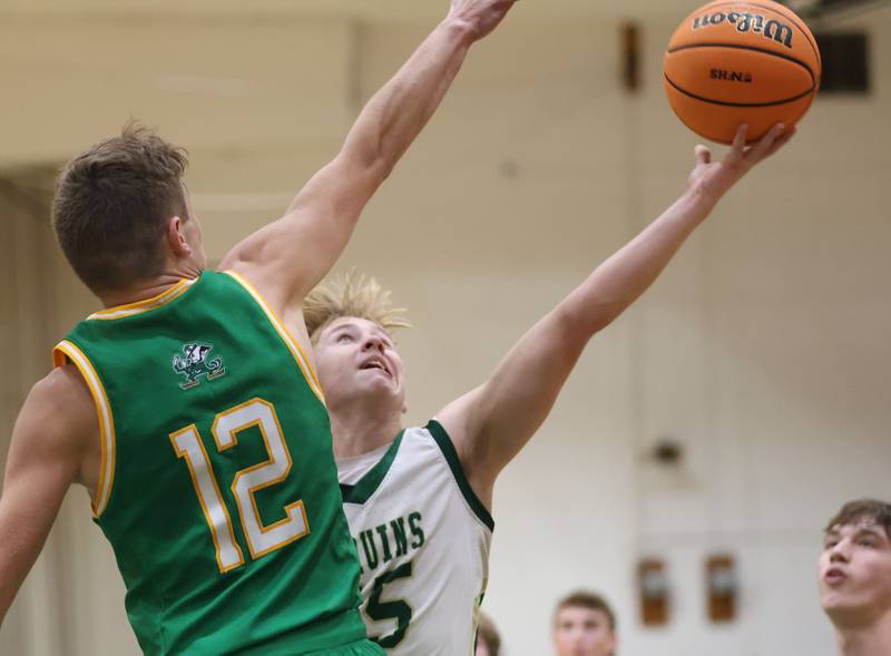 St. Bede's Gino Dinges lets go of a shot over Seneca's Matt Stach on Tuesday, Dec. 16, 2025 at St. Bede Academy.