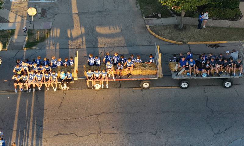 The Princeton High School football team ride during the homecoming parade on Thursday, Sept. 25, 2025 along South Main Street in Princeton .