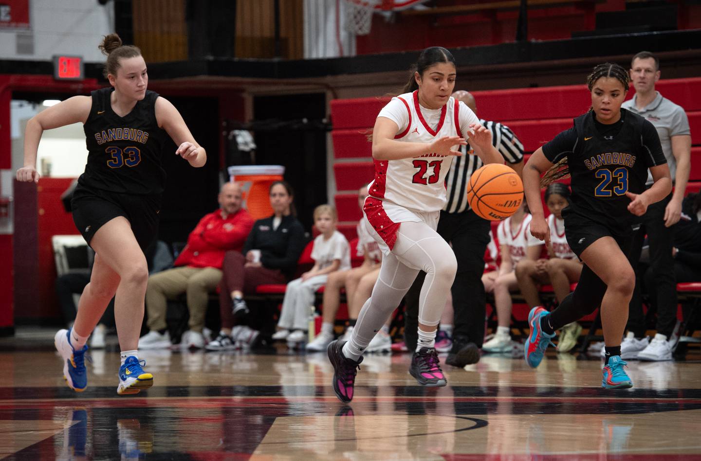 Bradley-Bourbonnais's Semma Mohammad, center, leads on a break over Sandburg's Audrey Haas, left, and Makaleigh Terry, right, in a game on Saturday, January 3, 2026.