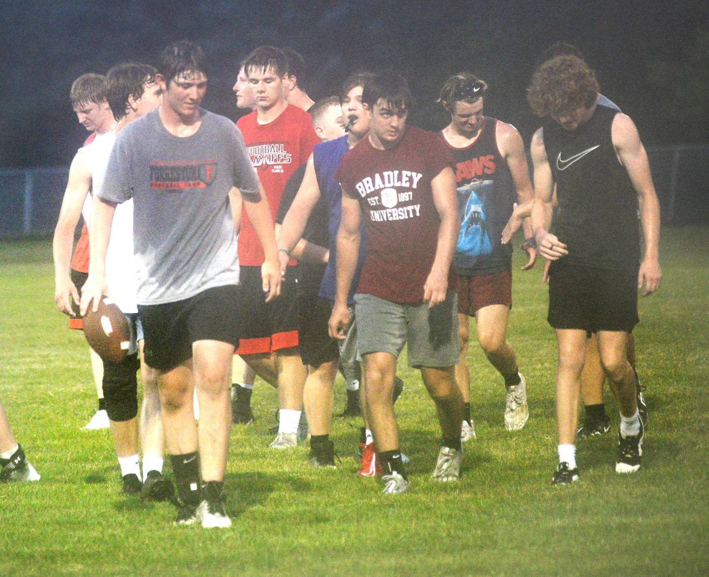Forreston players walk off the field following a scrimmage on the Cardinals football field on Thursday, July 27.