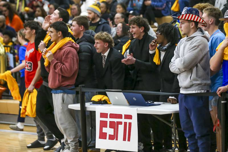 The Oswego student section cheers on the team during their basketball game between Yorkville at Oswego, Feb 7, 2026 in Oswego.