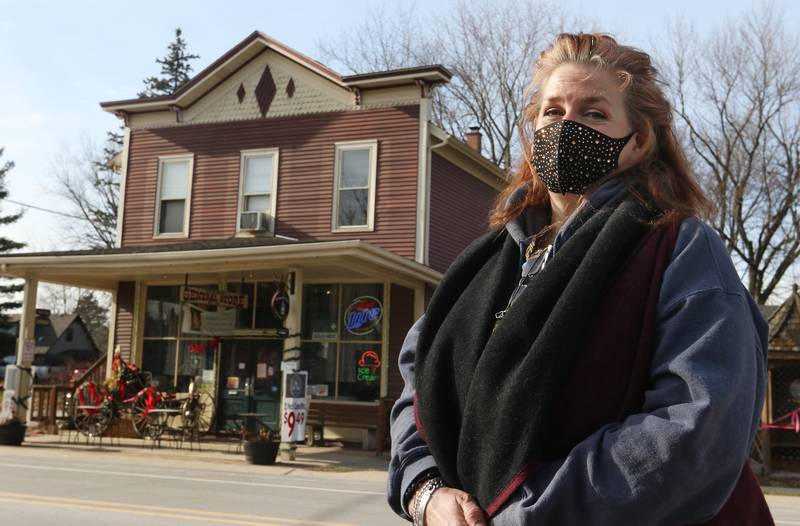 Heather Ferris poses for a portrait outside of her General Store on Tuesday, Dec. 15, 2020, in Greenwood.  Ferris, also the village treasurer, is co-owner of the business along with her husband, John, who is also the village president. The building has been a general store since its construction in 1894 and was also the township's post office.