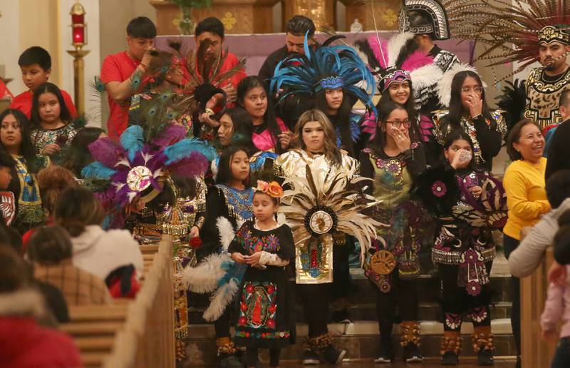 Parishioners wear outfits during the Lady of Guadalupe event on Tuesday, Dec. 12, 2023 at St. Hyacinth Church in La Salle. Our Lady of Guadalupe, also known as the Virgin of Guadalupe, is a Catholic title of Mary, mother of Jesus.k