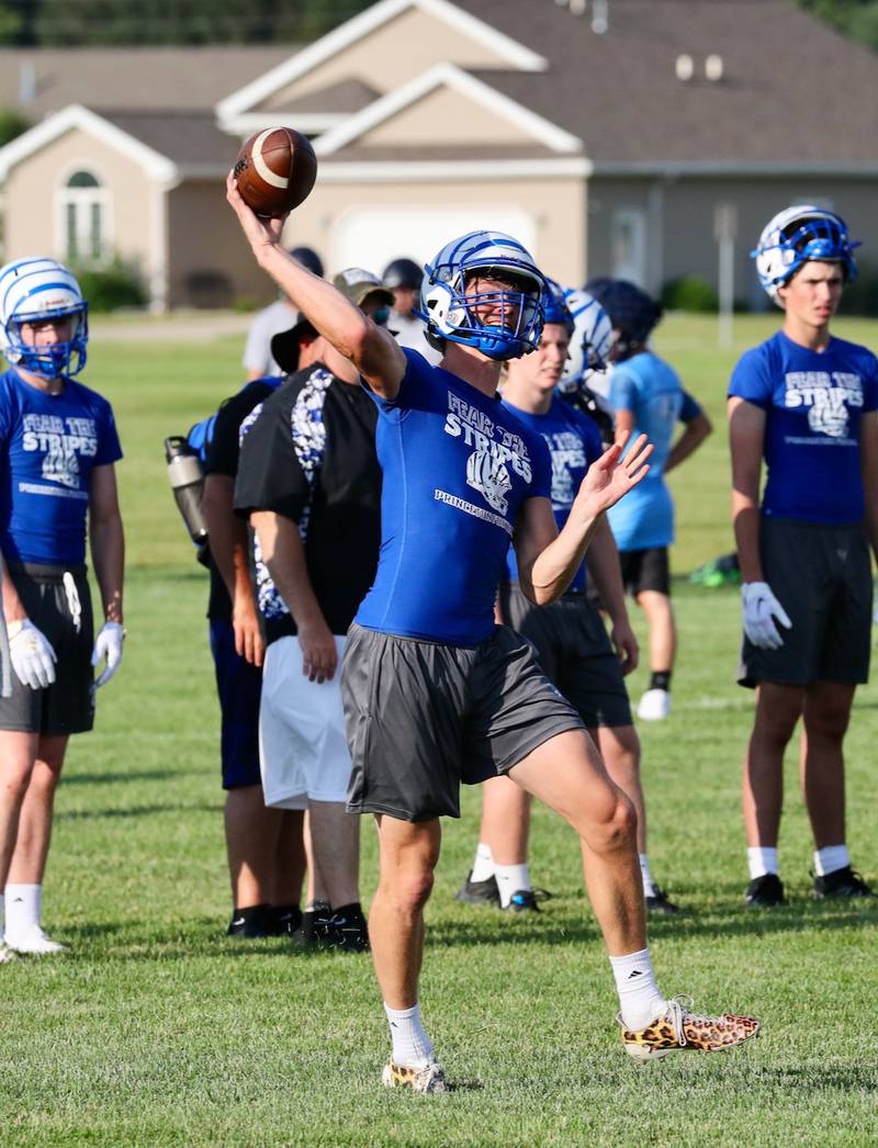 PHS senior quarterback Teegan Davis steps in to a throw during Monday's 7 on 7 game with Bureau Valley at Little Siberia.