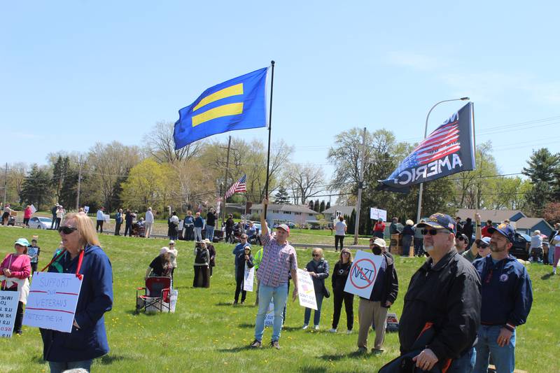 Attendees at a rally supporting veterans listen to speakers on April 27, 2025 in McHenry.