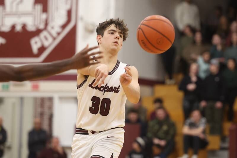 Lockport’s Evan Dziadkoweic passes the ball against Lincoln-Way East on Friday, Dec. 1, 2023 in Lockport.
