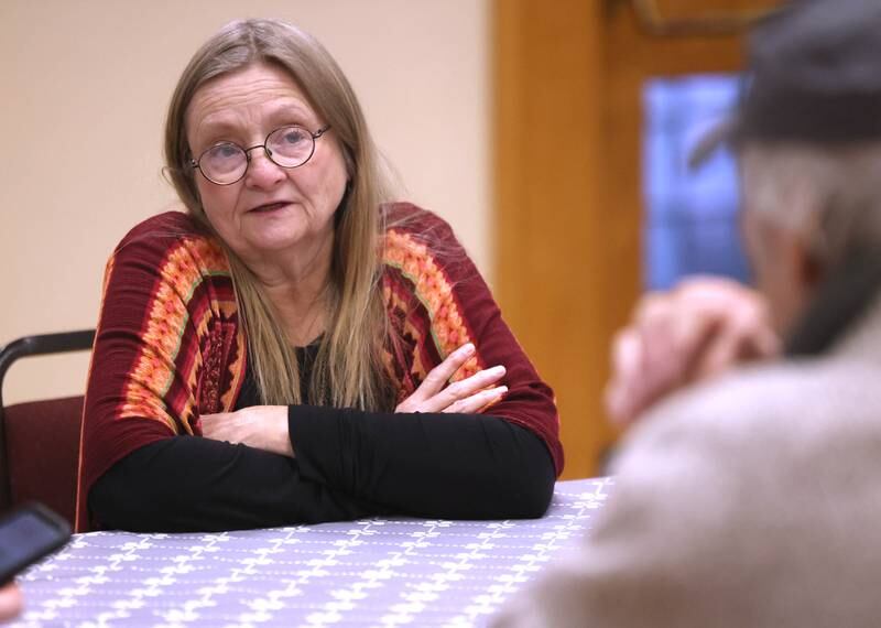 Marreen Buntaine, director of the community empowerment campaign with the Unitarian Universalist Congregation of DeKalb, talks Thursday, Jan. 23, 2025, at the church, about the need the warming center fills for community members. The warming center, which is open nightly during the winter months, offers free hot meals to all and a warm, safe place for those who need a refuge from the cold.
