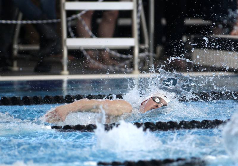 Hinsdale Central’s Nate Harris competes in the consolation heat of the 200-yard individual medley during the IHSA Boys Swimming and Diving Championships at FMC Natatorium in Westmont on Saturday, Feb. 26. 2022.