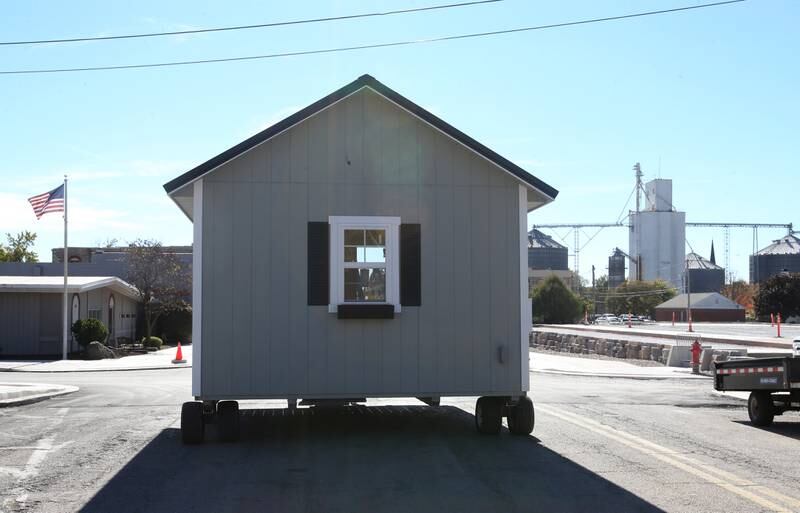 Crews move huts into the retail site plaza on Wednesday, Oct. 16, 2024 downtown Utica.