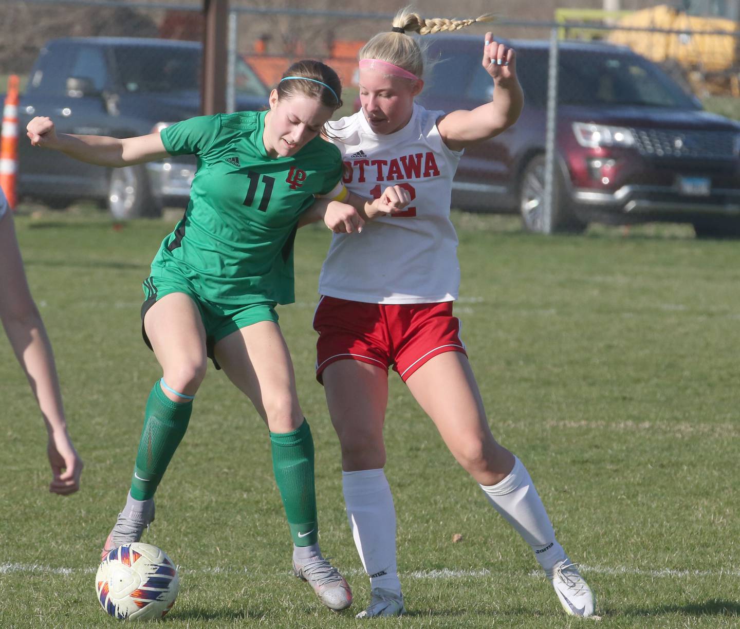 L-P's Danica Scoma keeps the ball away from Ottawa's Taylor Brandt on Monday, April 10, 2023 at the L-P Athletic Complex in La Salle.