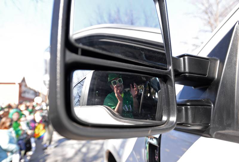 Steven Paterkiewicz drives the Elmhurst Park District van while participating in the Elmhurst St. Patrick's Day Parade Saturday, March 9, 2024.