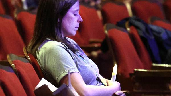 Photos: Safe Passage hosts domestic violence vigil