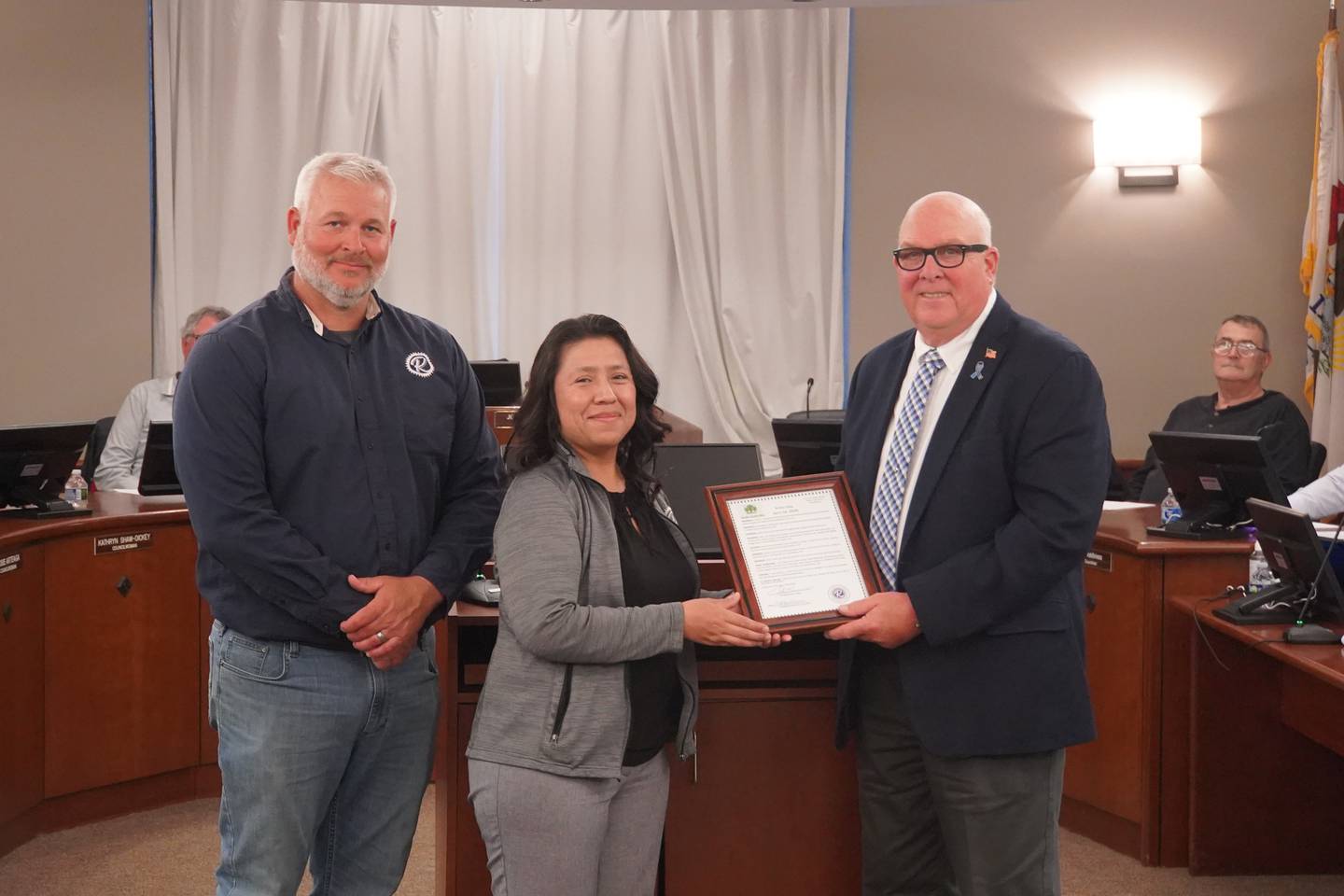 At the Monday, April 27, meeting of the Rochelle City Council, Mayor John Bearrows (right) read a proclamation in honor of Arbor Day on April 24. The proclamation was accepted by City Public Works Director Tim Isley (left) and Deputy Clerk Rocio Belmonte (center).