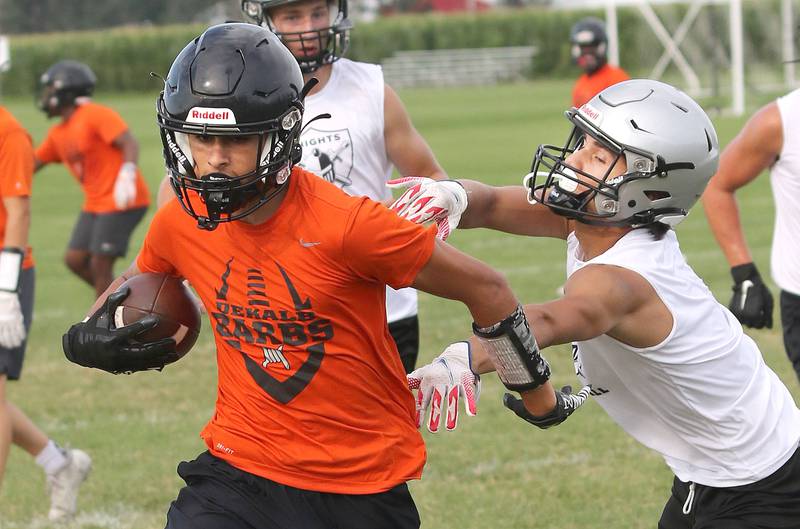 Kaneland and DeKalb players compete during 7-on-7 drills Tuesday, July 26, 2022, at Kaneland High School in Maple Park.