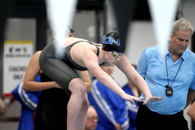 St. Charles North’s Isabelle Beu takes off from the block for the anchor leg of the 400-yard freestyle relay during the IHSA Girls State Championship preliminaries at the FMC Natatorium in Westmont on Friday, Nov. 11, 2022.