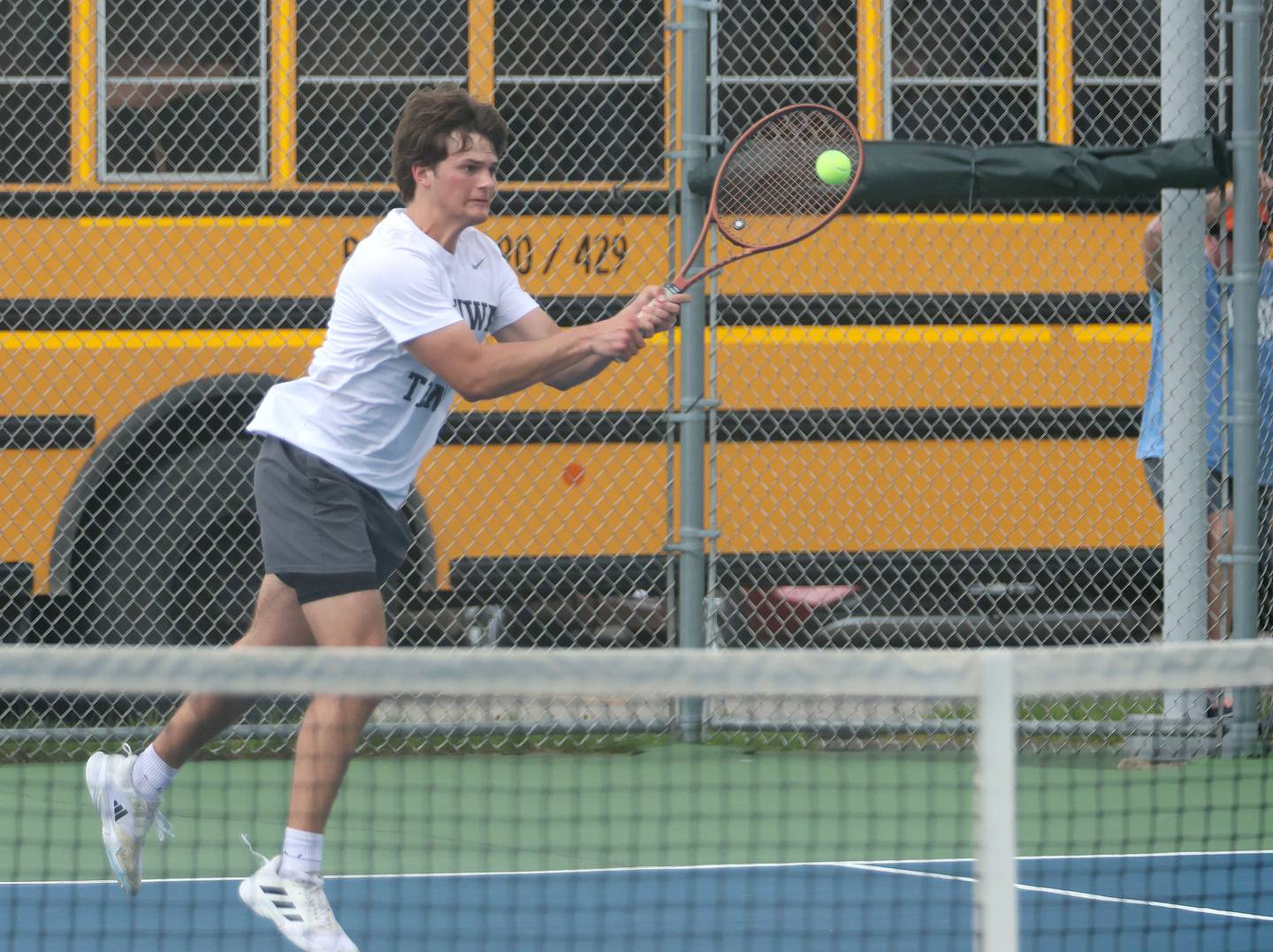 Ottawa's Eli Jeppson returns a serve on Tuesday, April 21, 2026 in the Henderson-Guenther Tennis Facility at Ottawa High School.