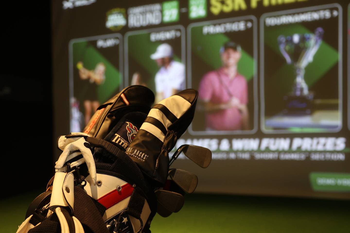X-Golf customers use their own clubs for the virtual golf experience.