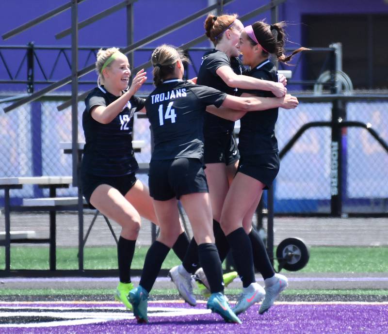 Downers Grove North’s Campbell Thulin (right) celebrates with teammates after scoring a goal during a game against Downers Grove South on May 10, 2025 at Downers Grove North High School in Downers Grove .