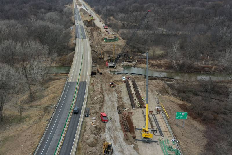 Crews with the Illinois Department of Transportation work on replacing a bridge structure on Interstate 180 over the Tiskilwa Bottom Road on Tuesday, March 18, 2025. According to IDOT, the $24.2 million dollar project includes replacing beams and decking on the current bridge.  During the replacement, only one-lane of traffic in each direction is using the northbound lanes as work happens on the southbound bridges. When that work is complete, traffic will be switched to the southbound lanes to begin work on the northbound bridges.