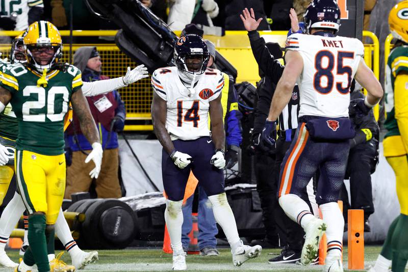 Chicago Bears wide receiver Olamide Zaccheaus (14) celebrates after scoring a touchdown against the Green Bay Packers during the second half of an NFL football game Sunday, Dec. 7, 2025, in Green Bay, Wis. (AP Photo/Mike Roemer)