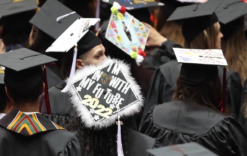 Many graduates had decorated their hats Saturday, May 14, 2022, for the first of two undergraduate commencement ceremonies at Northern Illinois University in DeKalb.