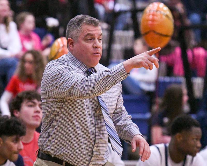 Oswego East's head coach Ryan Velasquez coaches from the sideline during the game on Friday Feb. 14, 2025, while taking on Yorkville at Oswego East High School.