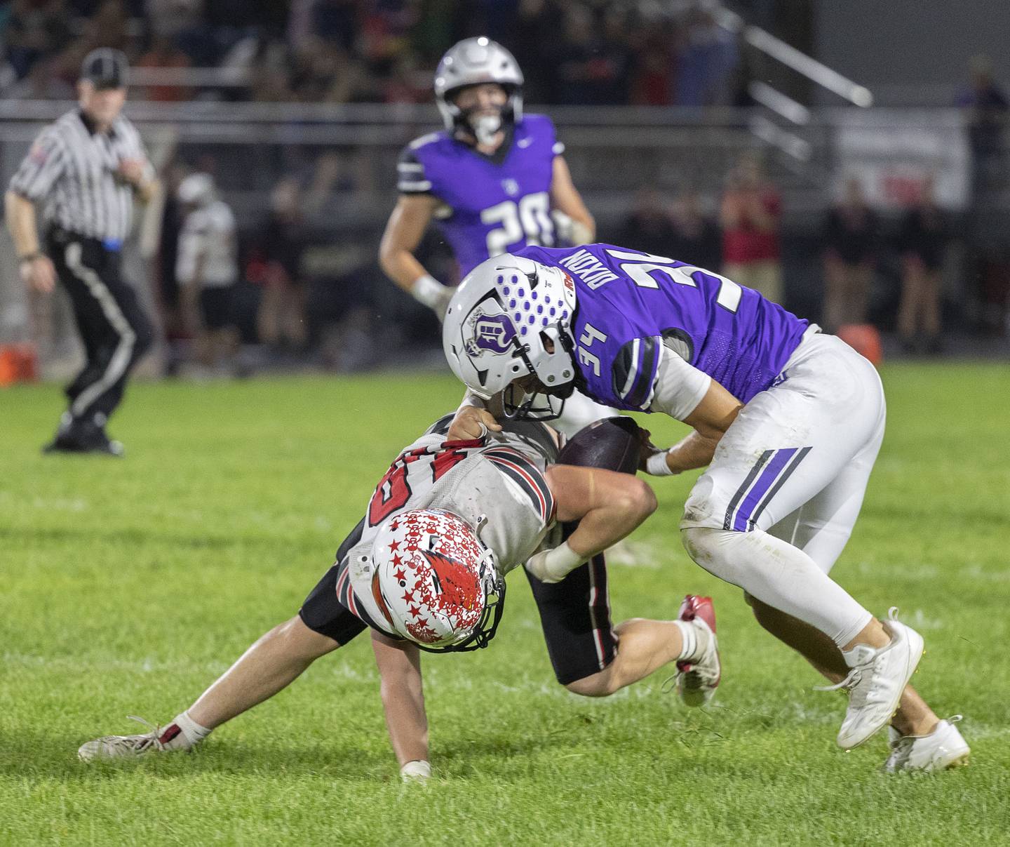 Dixon’s Owen Belzer strips a Stillman Valley receiver of the ball Friday, Oct. 3, 2025.