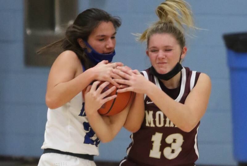 Hinckley-Big Rock's Sydney Razo-Ewan and Morris' Libby Wright fight for a loose ball during their game Tuesday, Jan. 4, 2022, at Hinckley-Big Rock High School.