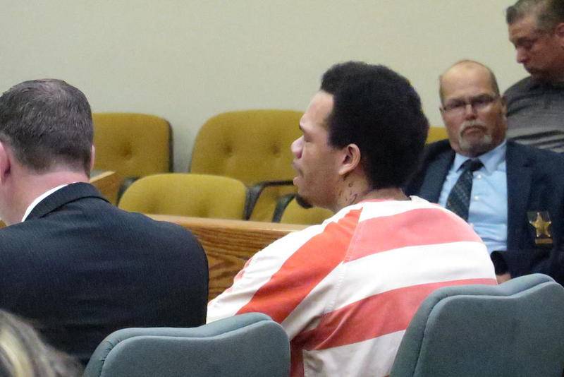 Dezzan Phillips, in orange-and-white, appeared emotional Friday at his sentencing hearing, as he spoke to Chief Judge H. Chris Ryan Jr. Phillips was ordered to prison for involuntary manslaughter, in connection with the death of Nicholas Puyear on Nov. 10 at a La Salle bar.
