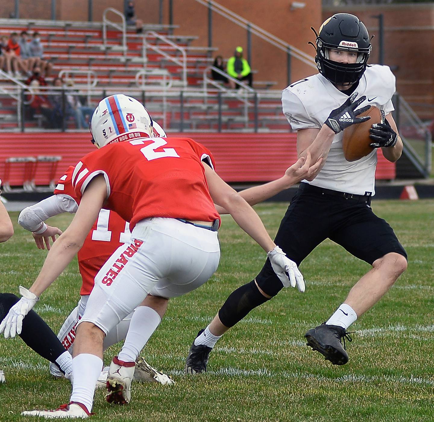 Sycamore's Ethan Storm tries to hang on to the ball after intercepting on a play in the first quarter Saturday at Ottawa.