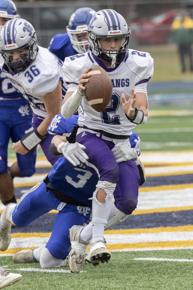 Ridgeview-Lexington’s Blaine Friedmansky looks to hand the ball off against Newman Saturday, Nov. 1, 2025, in round one of the Class 2A football playoffs.