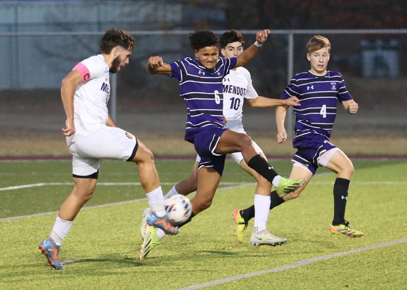 Mendota's David Casas kicks the ball ahead of Peoria Christian's Trae Brickner during the Class 1A Sectional game on Wednesday, Oct. 30, 2024 at Chillicothe High School.