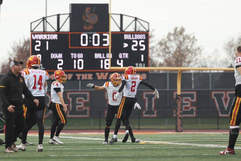 Batavia’s Michael Vander (8) and Isaiah Brown (2) celebrate as time expires in their 25-12 win over Lincoln-Way West on Saturday, Nov. 9, 2024 in New Lenox.