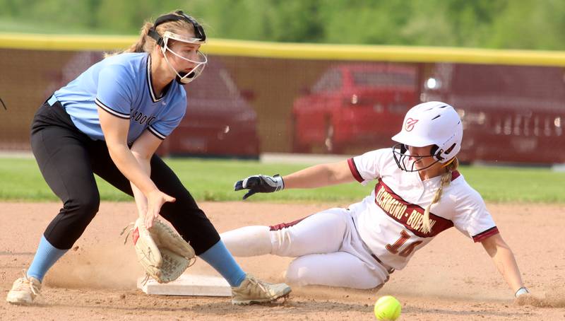 Richmond-Burton’s Taylor Davison slides safely into second base with a steal as Regina Dominican’s Ella Grillo fields the throw in Class 2A Regional title softball action at Richmond Friday night.