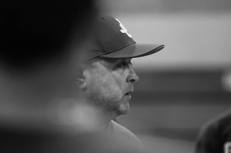 Joliet Catholic head coach Jared Voss talks to the team at the end of indoor practice after their game was rescheduled due to weather on Tuesday, March 14th, 2023 in Joliet.