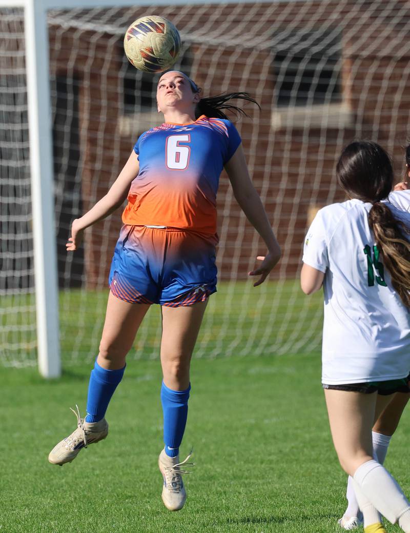 Genoa-Kingston's Zoe Boylen heads the ball Thursday, April 23, 2026, during their game against North Boone at Genoa-Kingston High School.