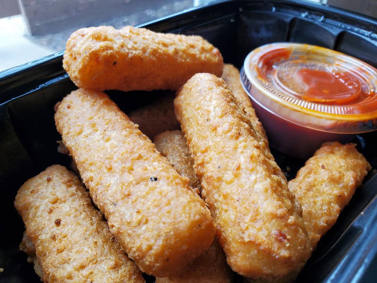 The mozzarella sticks from Jameson's Pub in Joliet were “stuffed full of cheese) and had a nice crunchy outside.