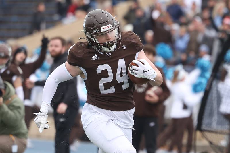 Joliet Catholic’s Larry Stringham breaks away for a touchdown run against Morris in the Class 5A semifinal on Saturday, Nov. 23, 2024.