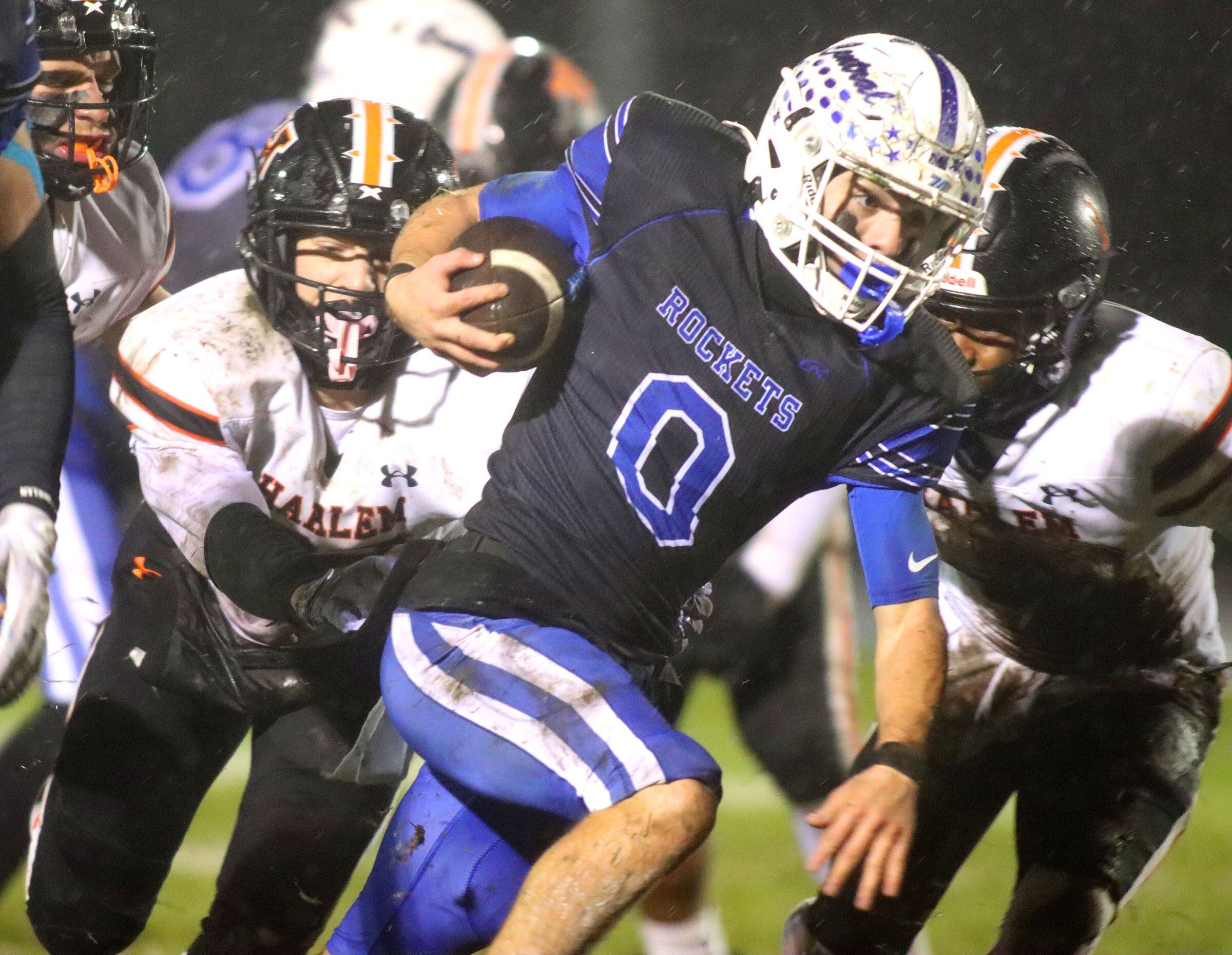 Burlington Central’s Henry Deering moves the ball against Harlem in IHSA football Class 6A second-round playoff action at Central High School in Burlington on Saturday, November 8, 2025.