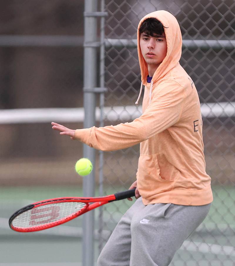 Dixon’s number two singles player Damien Beck winds up to hit a forehand during his match against Sycamore Thursday, March 30, 2023, at Sycamore High School.