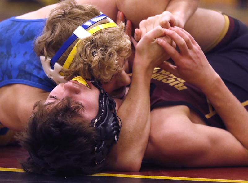 Johnsburg's Jared Lopez pins Richmond-Burton's Zach Huston during the 132-pound match of a Kishwaukee River Conference wrestling match on Thursday, Jan. 25, 2024, at Richmond-Burton High School.