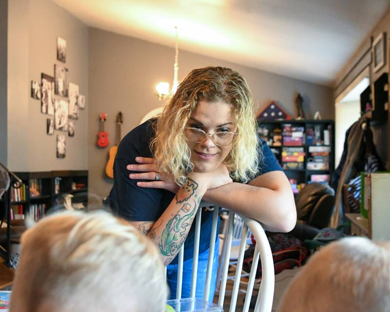 Brooke Christenson watches her sons Malcom, 5, and Maverick, 3, feed their jumping spider on Friday Oct. 3, 2025, in St Charles Township.
