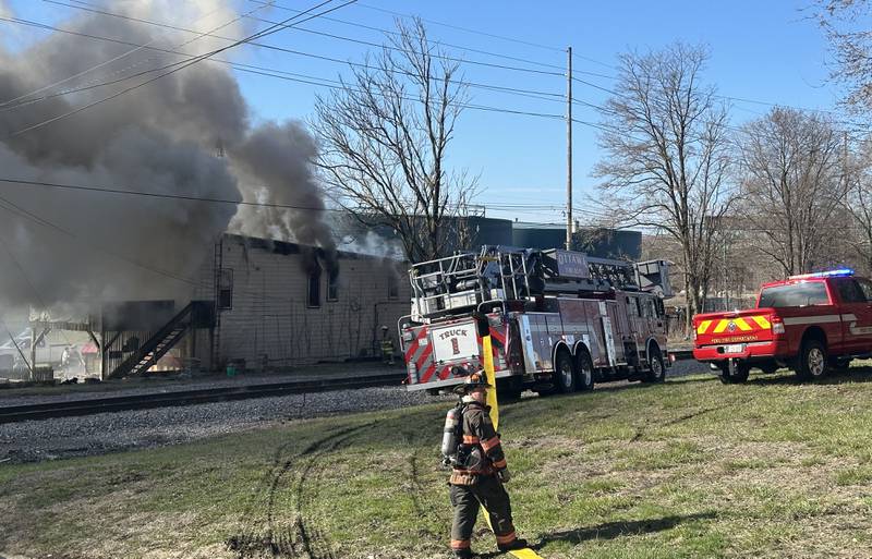 Ottawa firefighter Nick Allegretti observes the fire scene on top of the hill of Pine Street looking at the heavy smoke at the former Platform 31 tavern on Monday, March 24, 2025 on Water Street in Peru. The fire was upgraded to a three-alarm summing ire departments from La Salle, Utica, Mendota, Tonica, Ottawa, Ladd, Spring Valley, Lostant, Cedar Point, Troy Grove and Peru responded to the fire.