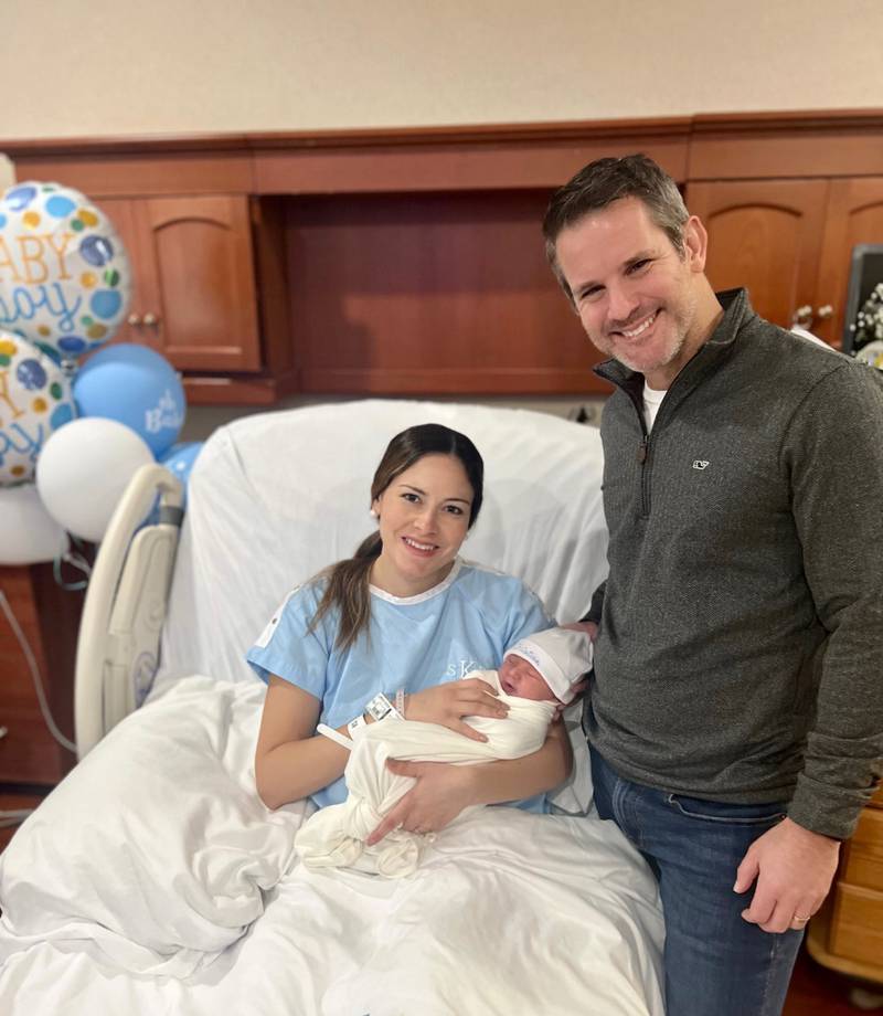 U.S. Rep. Adam Kinzinger (right) poses for a photo with his newborn son Christian Adam Kinzinger and his wife Sofia Boza-Holman.