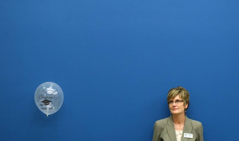 Judge Robbin Stuckert watches the DeKalb County Drug/DUI Court's ninth graduation ceremony from the side of the Gathertorium room inside the DeKalb County Legislative Building in Sycamore, Ill. on Friday, Dec. 7, 2012.