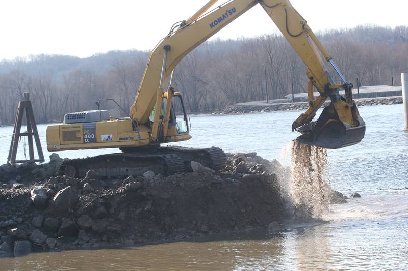 An excavator dredges the harbor at Barto Landing on Wednesday, March 26, 2025 in Spring Valley.