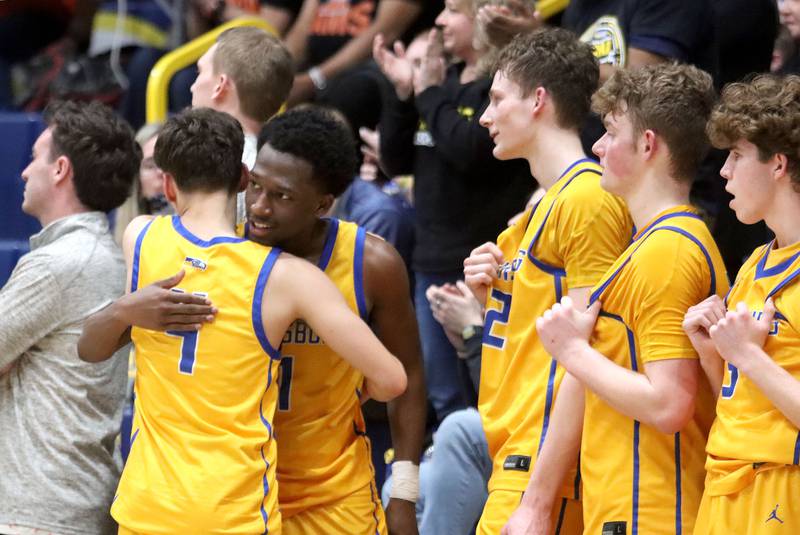Johnsburg’s Jarrel Albea, facing left, and the Skyhawks react as time winds down in a loss to Peoria Manual in boys IHSA Class 2A Supersectional basketball on Monday, Mar. 9, 2026, at Sterling High School in Sterling.