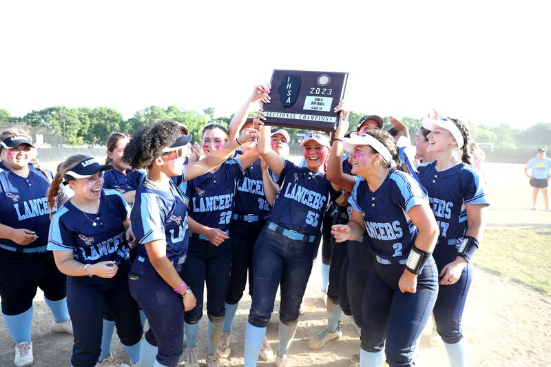 Lake Park players celebrate their victory over St. Charles North in the Class 4A St. Charles North Sectional final on Friday, June 2, 2023.