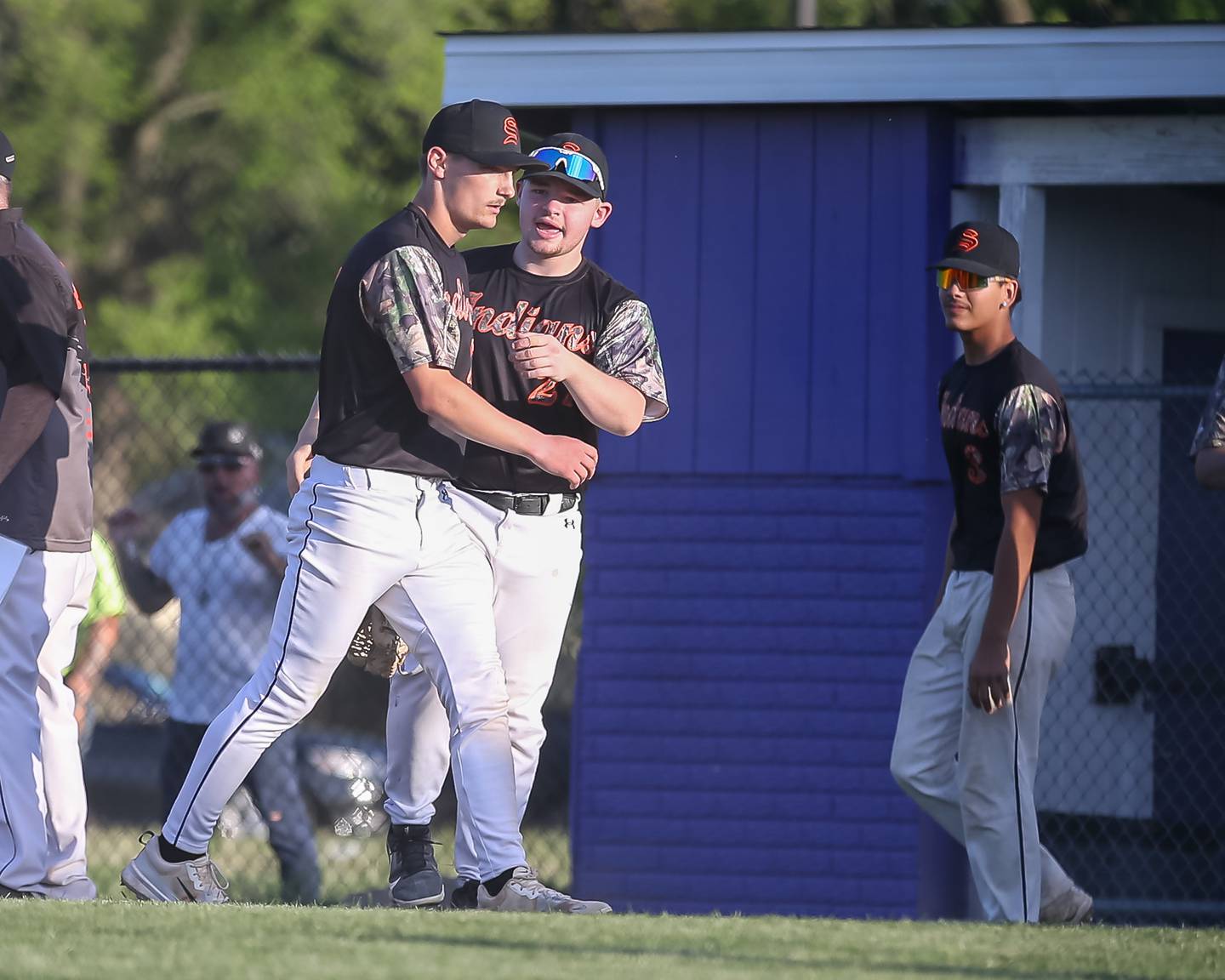 Sandwich's Chance Lange (27) is greeted by teammates after winning by striking out the last Plano batter during baseball game between Sandwich at Plano.  May 8, 2024