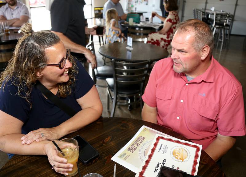 Vicky and Dan Skulski (All Around Garage Door) chat at Fox Republic Brewing Company on Wednesday, June 25, 2025.